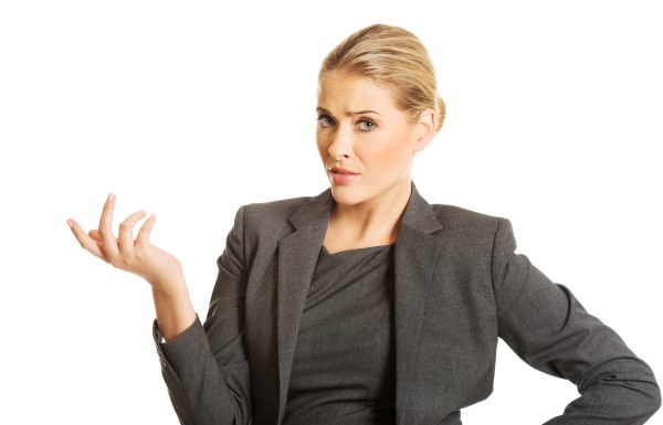 Confused woman showing irritate gesture.