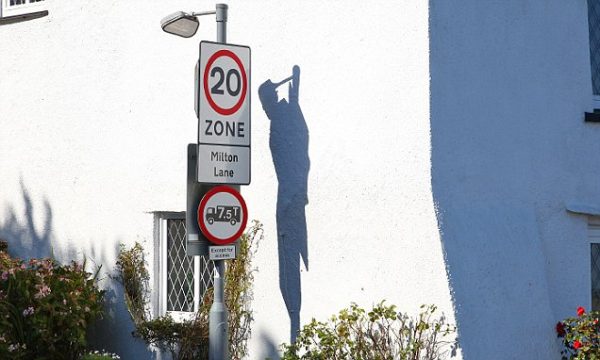 PIC: IAN WILLIAMS/APEX 30/09/2015 Residents of a small town have been getting spooked after the shadow of a hanging man mysteriously appeared at a place called Dead Man's Cross. The spooky shadow of a hanging man at Dead Man's Cross in Dartmouth, Devon - the spot where criminals were hanged - has been sending chills down people's spines. It appears to be created by the shadows cast by a road sign post onto the gleaming white walls of a nearby cottage. Incredibly the angle of the sun seems to create what appears to the image of a figure suspended from a gallows with their hands tied behind their back. Dozens of people have commented on the photo to say it is 'very spooky' and 'creepy'. ** SEE STORY BY APEX NEWS - 01392 823144 ** ---------------------------------------------------- APEX NEWS AND PICTURES NEWS DESK: 01392 823144 PICTURE DESK: 01392 823145