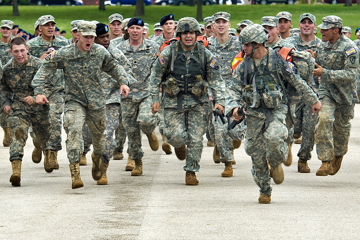 Sept. 16, 2010 Ð Two Soldiers from Fort Richardson, Alaska are cheered on as they run down the final straight to the finish line during 13-mile road march. The 14th Annual Warfighter Challenge at Ft. Leonard Wood Missouri brings military police units throughout the Army together to determine who is the best in the MP field. (DoD photo by Benjamin Faske)