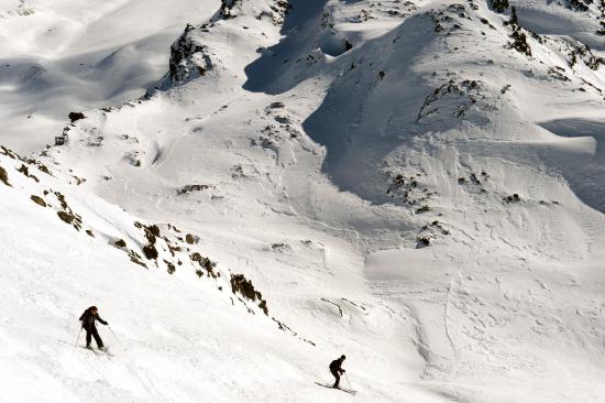 People slide on a free slope despite a high avalanche risk at the French ski resort of Meribel in the French Alps on March 7, 2013. AFP PHOTO / PHILIPPE DESMAZES (Photo credit should read PHILIPPE DESMAZES/AFP/Getty Images)