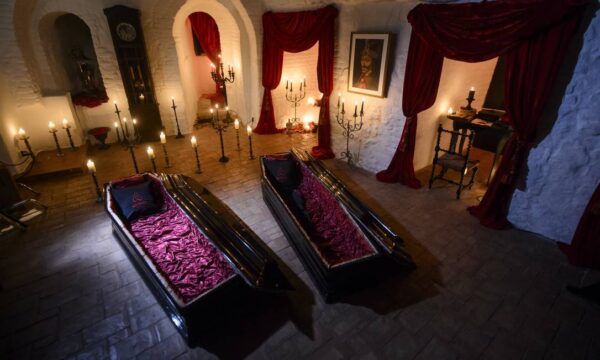 62169283_in-this-picture-taken-oct-9-2016-two-coffins-are-lit-before-a-photo-shoot-in-bran-castle-in