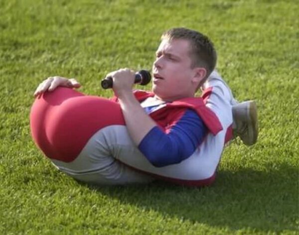 Rubberboy, aka Daniel Browning Smith of Meridian Mississippi chats with the crowd during one of his contortion maneuvers in between innings entertainment Wednesday night.(Photo by TJ Hamilton/Grand Rapids Press)