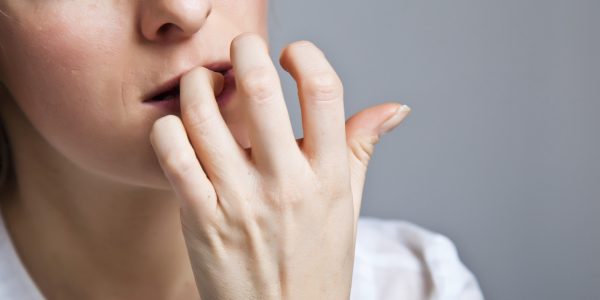 Woman in depression on gray background