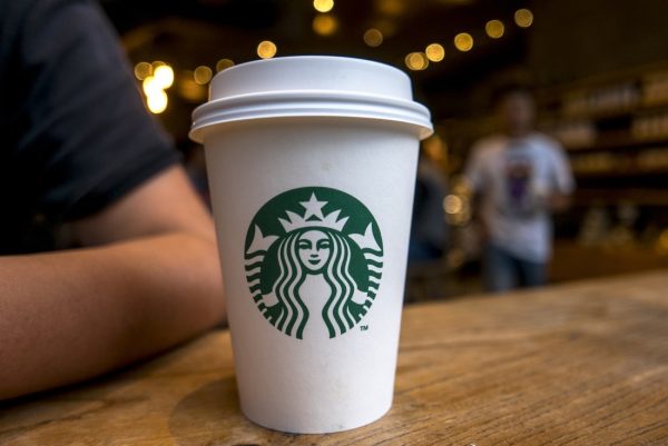 CHENGDU, SICHUAN PROVINCE, CHINA - 2015/09/13: Coffee cup on table in a Starbucks cafe. Starbucks is streamlining the ordering process so customers are able to get that cup of coffee faster than usual. (Photo by Zhang Peng/LightRocket via Getty Images)