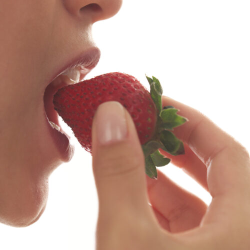Woman Eating Strawberry