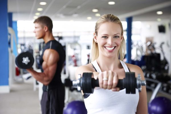 Young Adults Lifting Weights at the Gym