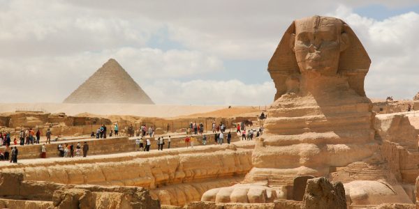 Great Sphinx of Giza (foreground) Pyramid of Menkaure (background). Cairo, Egypt, North Africa.