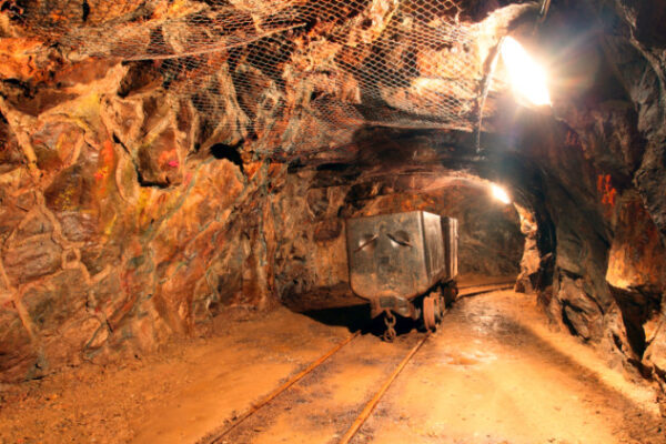 Tunnel with mining machine in gold silver and copper mine