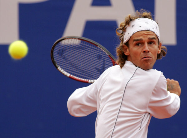 Monaco, MONACO: Brasilian player Gustavo Kuerten hits the ball against Croatian player Mario Ancic during Masters series Monte-Carlo 12 April 2005 in Monaco. AFP PHOTO PASCAL GUYOT (Photo credit should read PASCAL GUYOT/AFP/Getty Images)