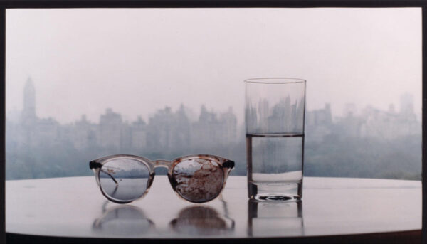 This limited editon photograph entitled "Season of Glass", by Yoko Ono, taken in 1981 and printed in 1994, showing John Lennon's blood covered glasses from his assassination, placed on a table with a glass of water, and taken in the couple's Dakota apartment overlooking New York's Central park, was made available in London, Friday April 12, 2002, to be sold by auctioneers Bonhams in London, scheduled for April 17. The photograph, one of six, was expected to fetch between 8,000 and 10,000 Pounds (US$ 11,440 and 14,300) in aid of artists' charity. (AP Photo/Yoko Ono, Bonhams)