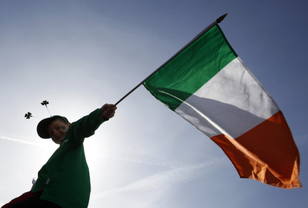 A boy holds a Republic of Ireland flag during a St Patrick's day march in central London March 15, 2009. REUTERS/Stefan Wermuth (BRITAIN SOCIETY)