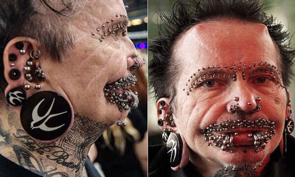 Rolf Buchholz, the world's most pierced man, attends a tattoo convention in Berlin on August 2, 2014. Buchholz has been barred from Dubai, where he was turned back at the airport on his way to a hotel appearance, a newspaper reported on August 17, 2014. Airport officials gave no reason for refusing entry to the 53-year-old German, who sports 453 piercings plus two horns on his forehead, local daily Al-Emarat Al-Youm said.They put him on a flight to Istanbul, it said. AFP PHOTO / DPA / PAUL ZINKEN +++ GERMANY OUT +++PAUL ZINKEN/AFP/Getty Images