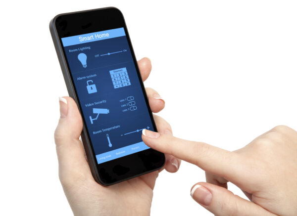 woman hand holding the phone with system smart house