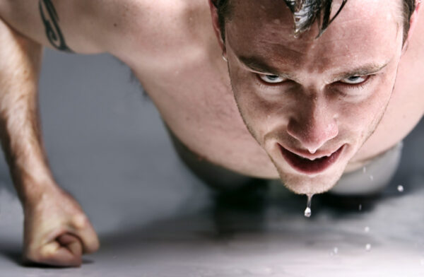 Sweating Young Man Doing Push-Ups