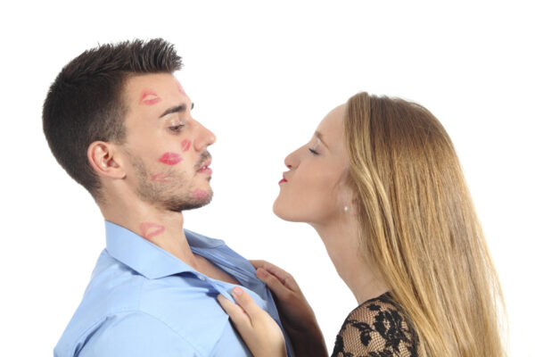 Woman trying to kiss a man desperately isolated on a white background