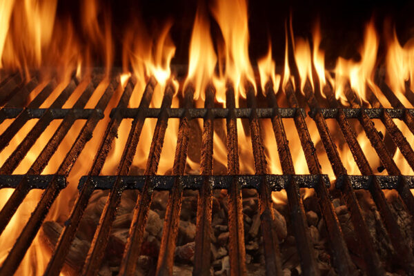 Empty Barbecue Charcoal Cast Iron Grill Close-up With Bright Flames Isolated On Black Background.