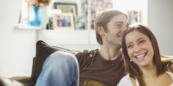 Couple sitting on sofa