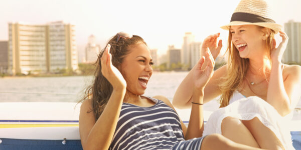 Women laughing together on boat