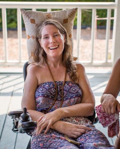 This July 24, 2016 photo provided by Niels Alpert, Betsy Davis, smiles during a going away party with her family and friends in Ojai, Calif.  In early July, Davis emailed her closest friends and family to invite them to a two-day celebration, telling them: "These circumstances are unlike any party you have attended before, requiring emotional stamina, centeredness, and openness.  And one rule: No crying."  Davis, diagnosed with ALS,  held the party to say goodbye before becoming one of the first California residents to take life-ending drugs under a new law that gave such an option to the terminally ill. (Niels Alpert via AP)