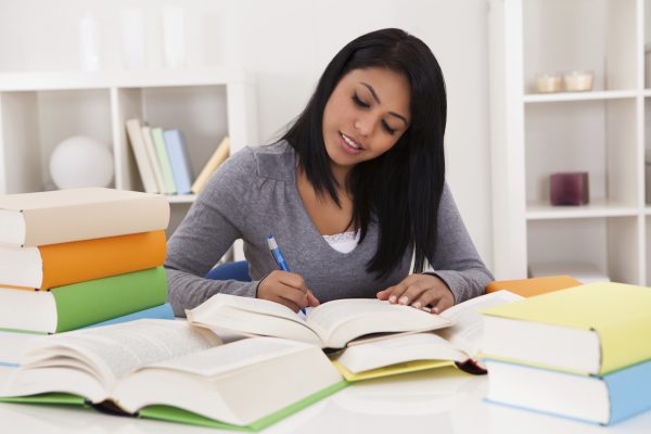 Portrait Of Young Woman Studying