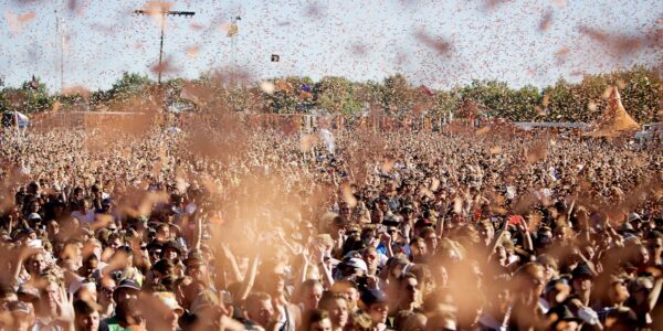 Ticker-tape floats down on spectators at the Roskilde Festival opens Wednesday, July 1, 2015, with around 50,000 spectators participating in the music festival. (AP Photo/POLFOTO, Thomas Borberg) DENMARK OUT