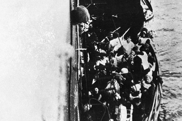 September 1912 --- Original caption: 1912- It's a high moment in the annals of real-life sea adventure as one of the crowded Titanic lifeboats is hoisted aboard the rescue ship Carpathia. When rescue operations were completed, the Carpathia carried a total of 711 survivors of the Titanic tragedy on to New York, which had been the ill-fated liner's destination. --- Image by © Bettmann/CORBIS