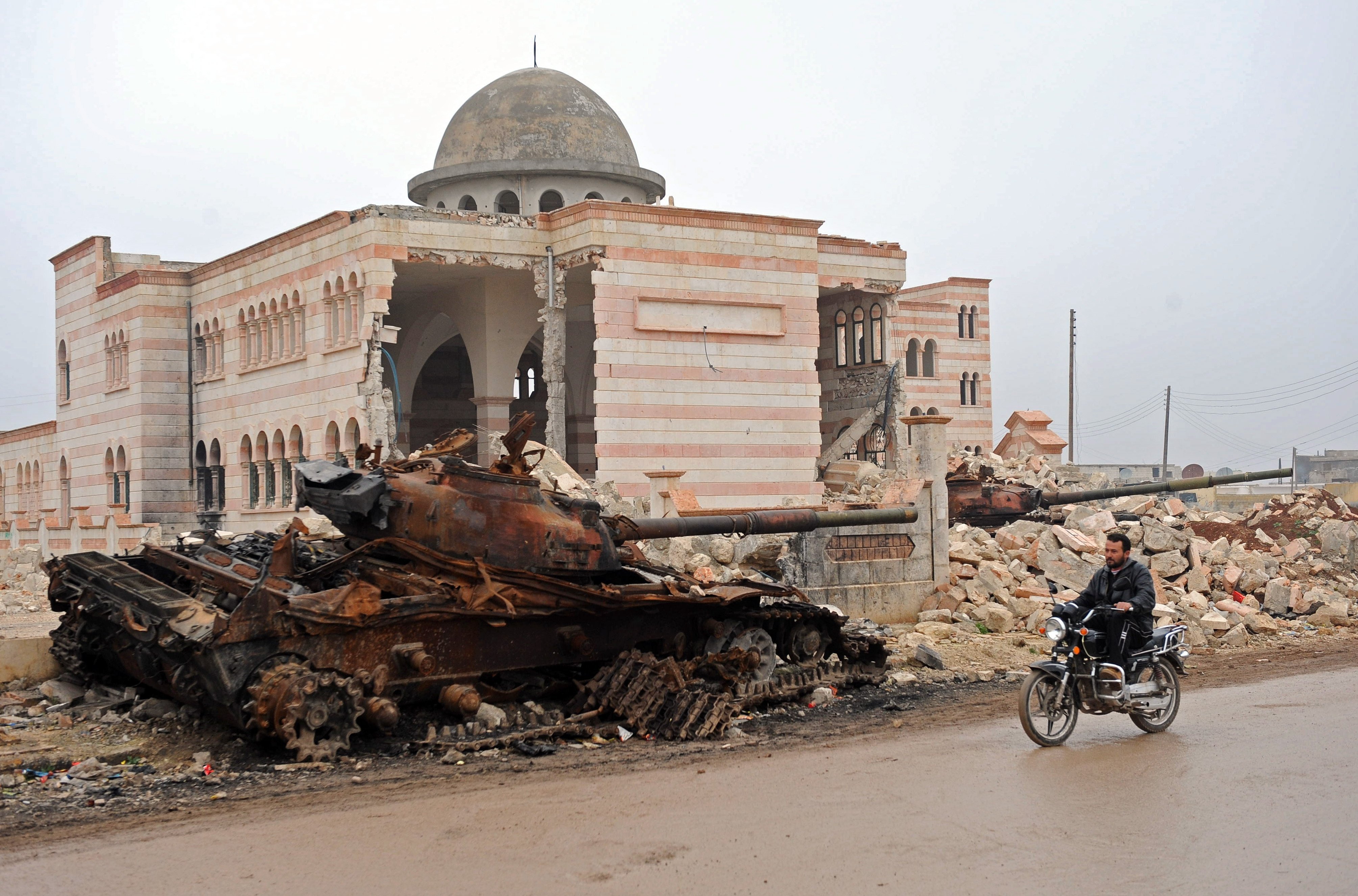 Some 60 civilians, most of them internaliy displaced, died and more than 100 were wounded when the Syrian army bombed the souk (main market) and surrounding houses in Azaz, northern Syria, in mid-January. In Azaz, in northern Aleppo province, the army set up a temporary base in an enormous mosque under construction in mid-June 2012, stationed armored vehicles around the perimeter and turned the two minarets into snipers' nests. (Andree Kaiser/MCT)