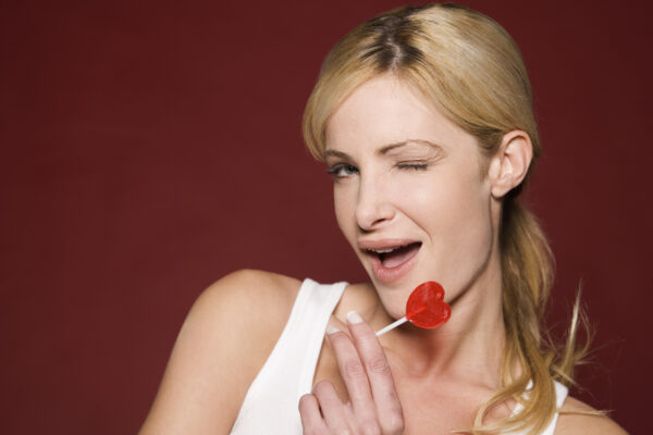 Playful woman with lollipop