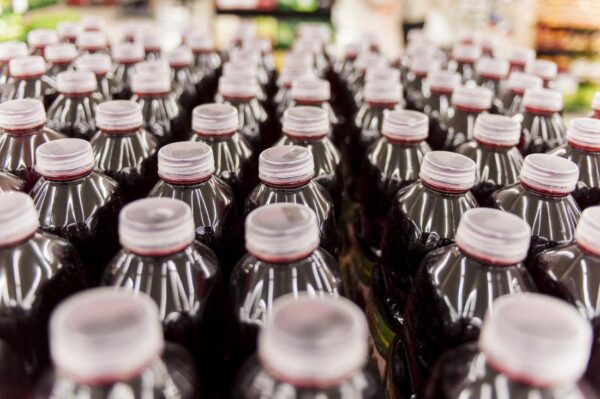 Rows of soft drink with white caps