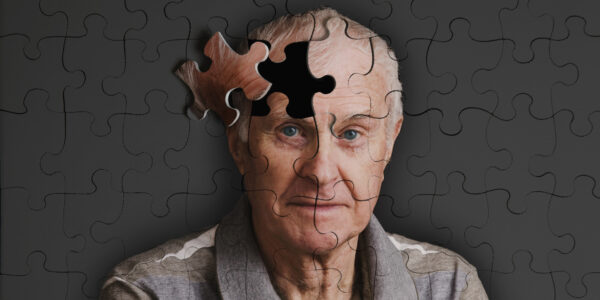 Jigsaw puzzle, of senior man, falling apart