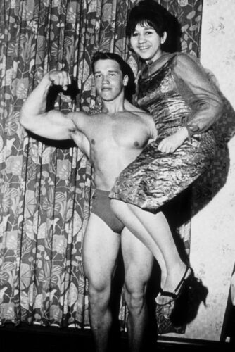 THAL, AUSTRIA - 1965: eighteen year old bodybuilder Arnold Schwarzenegger lifts a friend in 1965 in Thal, Austria. (Photo by Michael Ochs Archives/Getty Images)