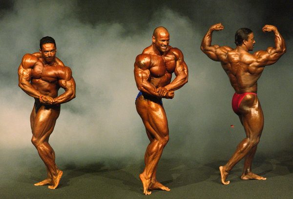 MELBOURNE - MARCH 15: Claude Groulx, John Davie and Troy Alves in action during the finals of the Australian Pro Body Building Grand Prix three at the John Batman Theatre in Melbourne, Australia on March 15, 2003. (Photo by Robert Cianflone/Getty Images)