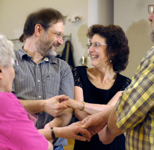 Heather Coit/The News-Gazette FOR FEATURES- Mitch and Frances Harris join another couple during contra dancing at Phillips Recreation Center in Urbana, Ill on Friday, May 16, 2008.
