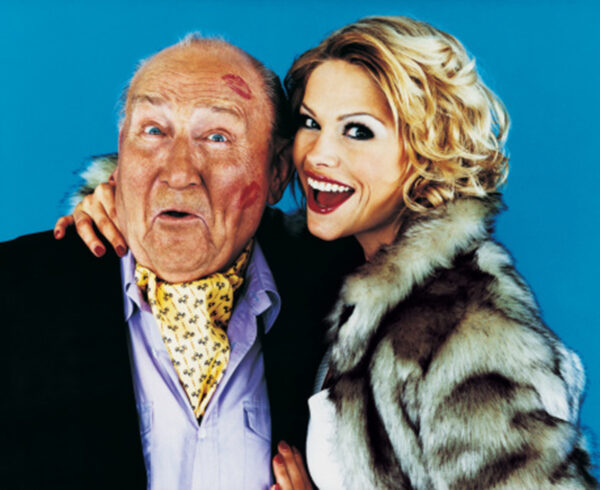 Portrait of a Woman with her Arm Around a Wealthy Senior Man