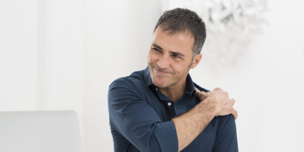 Businessman Suffering From Shoulder Pain