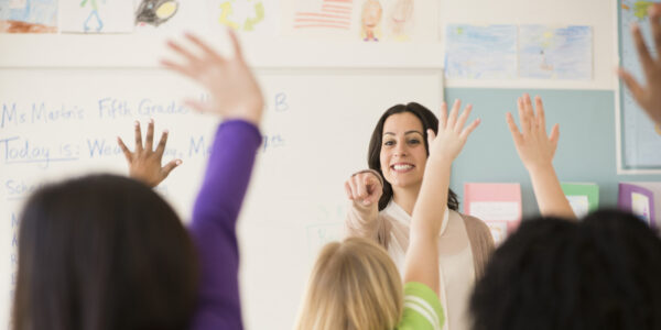 Teacher calling on student in classroom