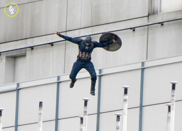 BERLIN, GERMANY - AUGUST 12: A stuntman dressed as Captian America jumps off a building while filming Captain America, Civil War on August 12, 2015 in Berlin, Germany. (Photo by Chad Buchanan/GC Images)