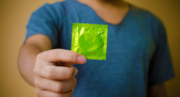 hand holding condom