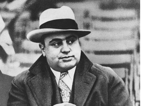 TO GO WITH STORY AL CAPONE LEGADO ** FILE ** Chicago mobster Al Capone is seen at a football game in Chicago on Jan. 19, 1931. Sixty years after Capone's death, the world's most famous gangster still draws a crowd in Chicago and visitors from all over the world come to search for anything Capone, who died Jan. 25, 1947. (AP Photo/File)