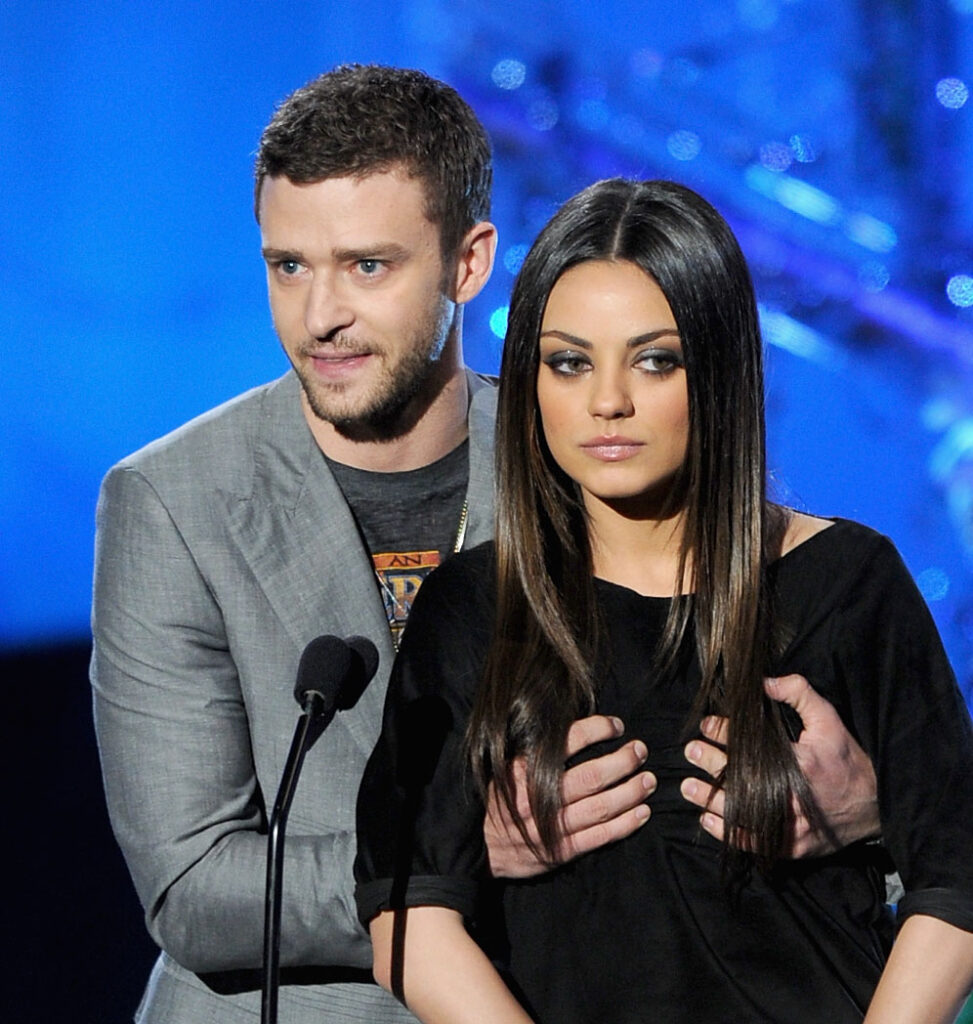 UNIVERSAL CITY, CA - JUNE 05: Actors Justin Timberlake (L) and Mila Kunis present an award onstage during the 2011 MTV Movie Awards at Universal Studios' Gibson Amphitheatre on June 5, 2011 in Universal City, California. (Photo by Kevin Winter/Getty Images)
