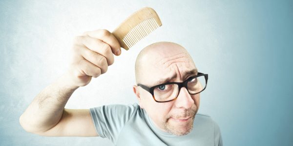 nostalgic man comb his bald head