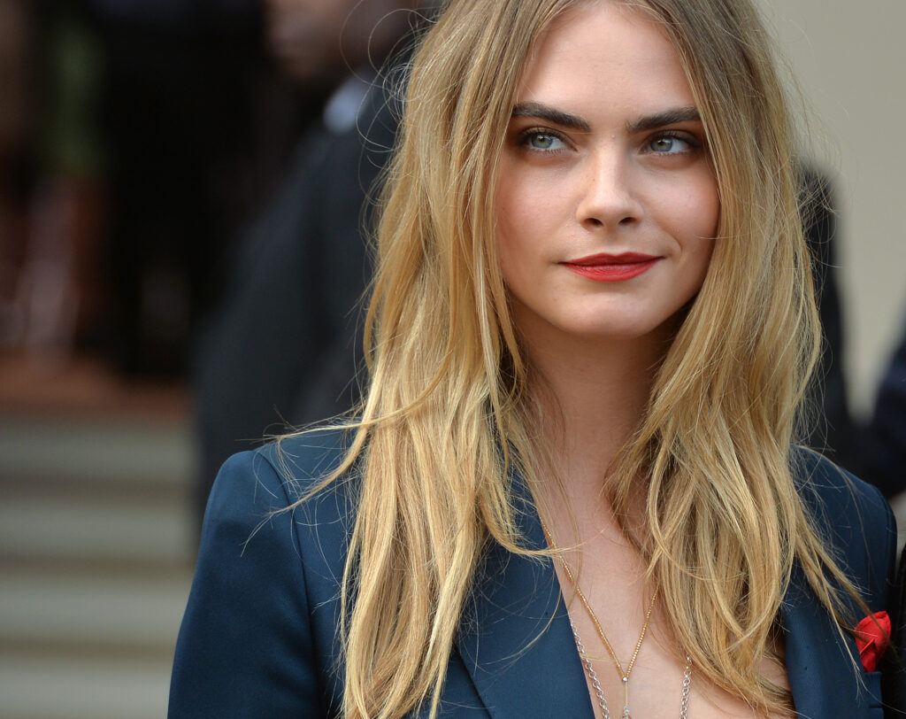 LONDON, ENGLAND - SEPTEMBER 15: Cara Delevingne attends the Burberry Prorsum show Womens wear 2015 during the London Fashion Weekk SS15 on September 15, 2014 in London, England. (Photo by Anthony Harvey/GettyImages)