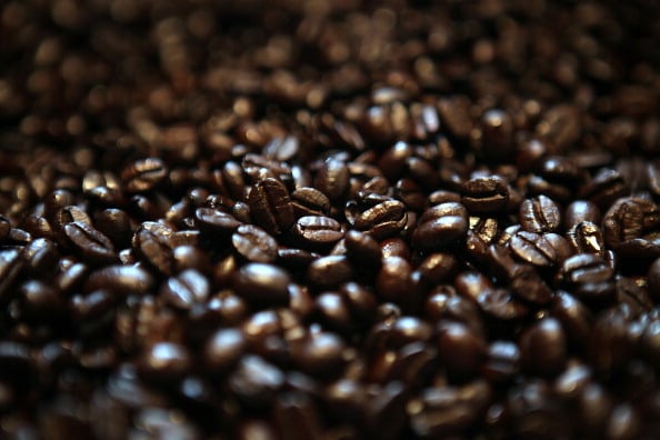 SAN FRANCISCO, CA - AUGUST 26: Freshly roasted coffee beans are sit in a bin at Graffeo Coffee on August 26, 2011 in San Francisco, California. Coffee shops across the country are being faced with the decision to raise retail coffee prices as wholesale coffee bean prices are surging. According to the International Coffee Organization, the daily average composite price of coffee beans has gone up nearly every day over the last 12 days. (Photo by Justin Sullivan/Getty Images)